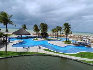 an aerial view of a pool at the beach at Hotel Pirâmides natal in Natal