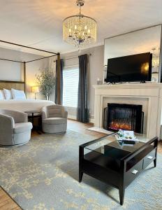 a living room with a bed and a fireplace at The Ginkgo Tree in Mount Pleasant