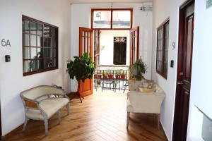 a living room with two chairs and a table at San Felipe Loft in Panama City