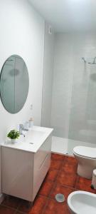 a bathroom with a sink and a toilet and a mirror at PUNTA SOL in Isla del Moral +35 photos