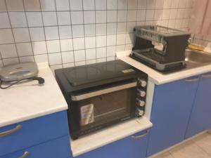 a small kitchen with a stove and a sink at Dimos apartments in Kokkino Nero
