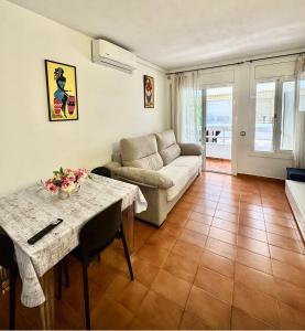 a living room with a couch and a table at Apartamento Tossa in Tossa de Mar