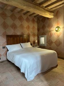 a bedroom with a large white bed in a room at Casa Tarabuso B&B in Reggio Emilia