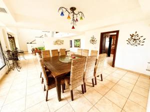 a dining room with a wooden table and chairs at Panáveda Ayurvedic Wellness Centre in El Creo