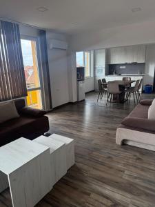 a living room with a couch and a table at Уютът на Ясен in Yasen