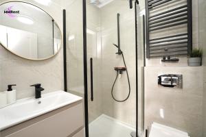 a bathroom with a shower and a sink at MMRent Grape Room in Gdańsk +9 photos