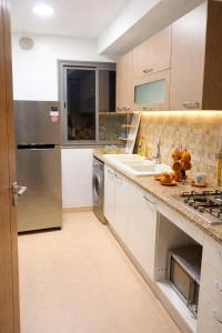 a kitchen with a sink and a dishwasher at Jed appartement in Hammam-Lif