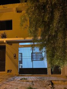 a building with a gate in front of a building at Casa em Seabra in Seabra