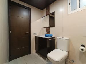 a bathroom with a toilet and a sink at GARRUCHA HOME AND BEACH in Garrucha +30 photos