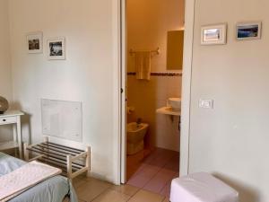 a room with a bathroom with a toilet and a sink at Respiro Mediterraneo in Mondello +44 photos