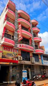 a building with a hotel class sign in front of it at Hotel Oasis in Riberalta