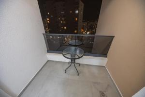 a balcony with a table and chairs on a balcony at Rajjan in Bar