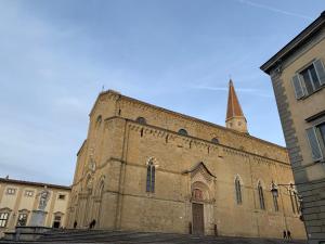 an old church with a steeple on top of it at Villa Flavia in Arezzo +28 photos