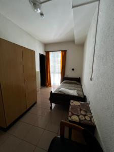 a bedroom with a bed and a table in it at Giada in Iragna