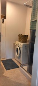 a washing machine with a basket on top of it at Szarotka in Brenno