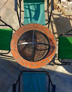 a fire pit sitting on top of a table at Hot Tub Paradise - Squirrel's House in Žabljak