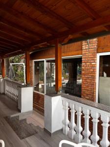 a porch of a house with a brick wall at H Veza in Spille