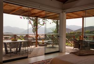 a bedroom with a view of the mountains at Ranch Pachacamac in Pachacamac