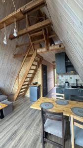 a kitchen with a wooden table in a room at Ditaket Dilijan in Dilijan +16 photos