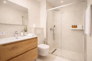 a bathroom with a shower and a toilet and a sink at Princess Palace Monaco in Monte Carlo