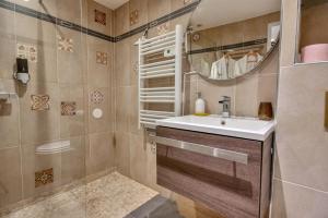 a bathroom with a sink and a shower at The Beach Dream in Saint-Laurent-du-Var +103 photos