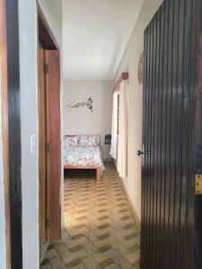 a hallway with a bed in a room at Espaço Meditare in Socorro +6 photos