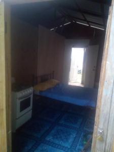 a small bedroom with a bed and a window at Mabouya Villas in Dennery