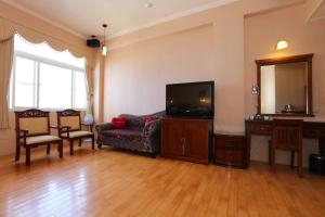 TV a/nebo společenská místnost v ubytování Di Bao Motel