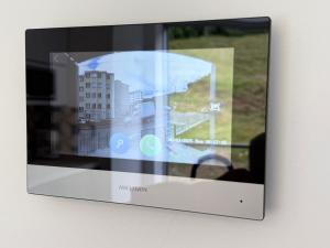 a television screen with a picture of a building at Casa Aurora in Manizales