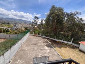 a tennis court on the roof of a house at Rincón de Paz y Tranquilidad in Ambato +8 photos