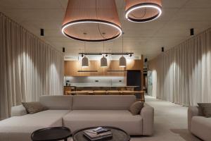 a living room with a couch and a table at Kai House in Lun