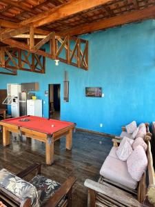 a living room with a ping pong table in it at Chácara Lobos in Sorocaba