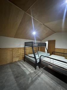 a large room with two bunk beds in a building at Rancho Las Bugambilias in Arteaga
