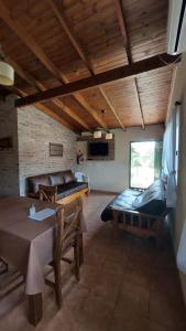 a living room with a couch and a table at Aroma de campo in Chascomús