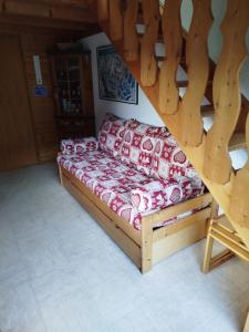 a couch sitting in the middle of a room at Châtel - Les Perthuis in Châtel