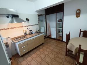 a kitchen with a sink and a counter top at Departamento CRIMAR in Viedma
