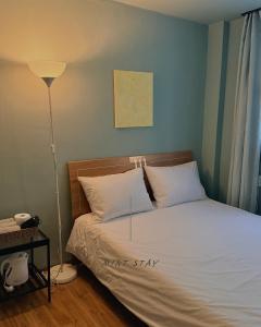 Llit o llits en una habitació de 민트스테이