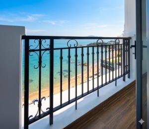 a balcony with a view of the beach at Hon Chong Retreat Hotel Nha Trang in Nha Trang