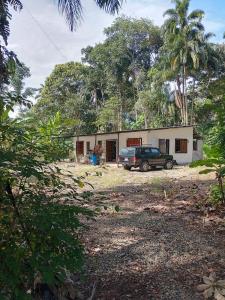 a car parked in front of a house at Chichicoland in Tena