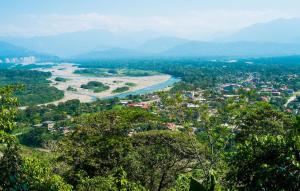 a view of a river and a city at Hotel Puerto Selva in Villa Tunari