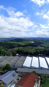 an overhead view of a group of buildings with white roofs at Apê com vista pro Vale dos Vinhedos in Bento Gonçalves
