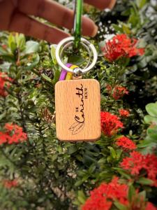 a key chain with a tag attached to a plant at The Corinth House in Corinthe +8 photos