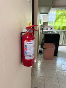 a fire hydrant hanging on a wall in a kitchen at The Corinth House in Corinthe