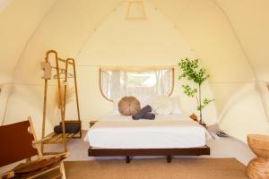 a bedroom with a bed in a tent at Suka Camping - Bentong in Bentong