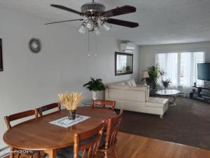 a living room with a table and a couch at Home Away From Home in Moncton