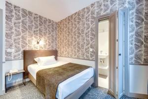 Ein Bett oder Betten in einem Zimmer der Unterkunft Passy Eiffel