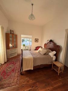 a bedroom with a large bed in a room at Timeless Villa on Parore in Dargaville