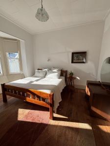 a bedroom with a large bed in a room at Timeless Villa on Parore in Dargaville