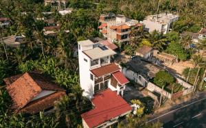 an overhead view of a house with red roof at Rockvin BnB in Midigama East +33 photos
