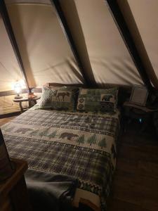 a bedroom with a bed in a tent at Simeon in Duchesne